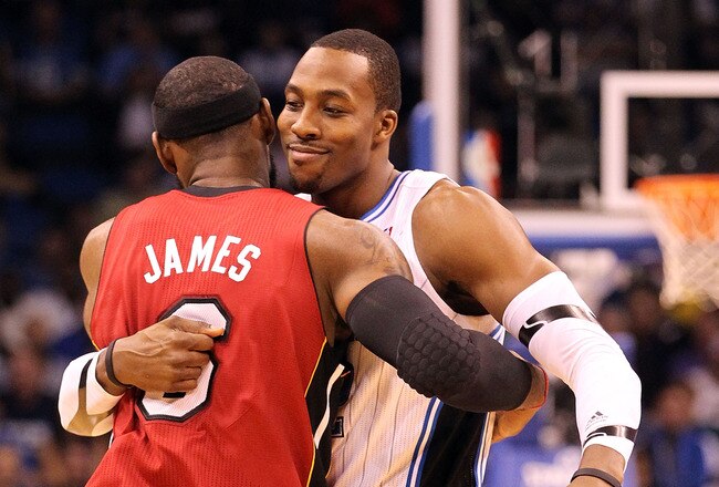 ORLANDO, FL - FEBRUARY 08:  LeBron James #6 of the Miami Heat hugs Dwight Howard #12 of the Orlando Magic during the game at Amway Center on February 8, 2012 in Orlando, Florida.   NOTE TO USER: User expressly acknowledges and agrees that, by downloading and or using this Photograph, user is consenting to the terms and conditions of the Getty Images License Agreement.  (Photo by Sam Greenwood/Getty Images)