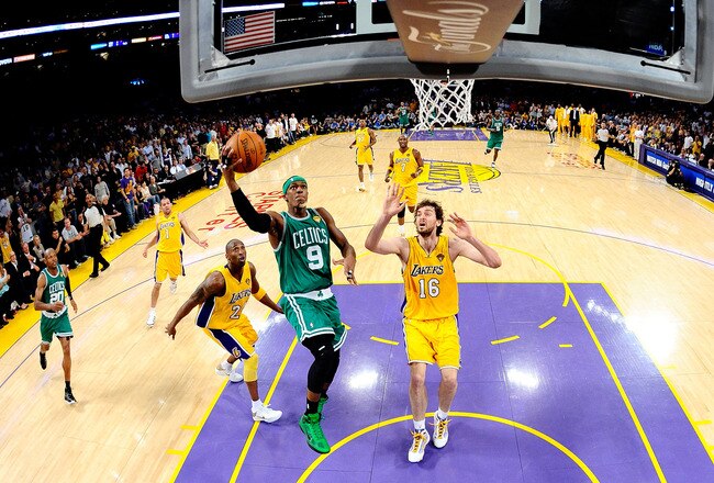 LOS ANGELES, CA - JUNE 17:  Rajon Rondo #9 of the Boston Celtics lays the ball up over Kobe Bryant #24 and Pau Gasol #16 of the Los Angeles Lakers in Game Seven of the 2010 NBA Finals at Staples Center on June 17, 2010 in Los Angeles, California.  NOTE TO USER: User expressly acknowledges and agrees that, by downloading and/or using this Photograph, user is consenting to the terms and conditions of the Getty Images License Agreement.  (Photo by Larry W. Smith-Pool/Getty Images)