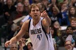 DALLAS, TX - JANUARY 04:  Dirk Nowitzki #41 of the Dallas Mavericks reacts after scoring against the Phoenix Suns at American Airlines Center on January 4, 2012 in Dallas, Texas. Nowitzki was playing in his 1,000 career game.  NOTE TO USER: User expressly acknowledges and agrees that, by downloading and/or using this Photograph, user is consenting to the terms and conditions of the Getty Images License Agreement.  (Photo by Ronald Martinez/Getty Images)