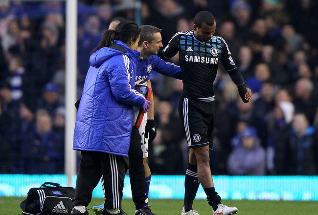 LIVERPOOL, ENGLAND - FEBRUARY 11:  Ashley Cole of Chelsea receives treatment for an injury during the Barclays Premier League match between Everton and Chelsea at Goodison Park on February 11, 2012 in Liverpool, England.  (Photo by Alex Livesey/Getty Images)