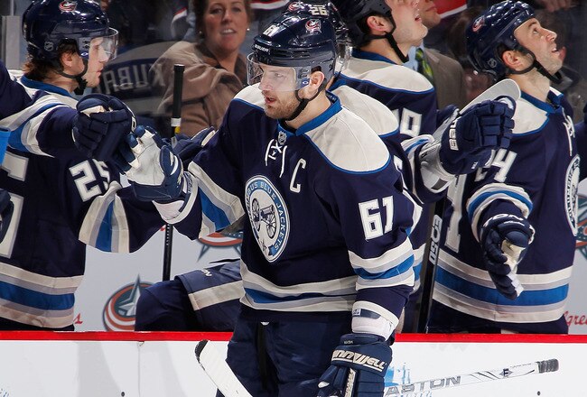 COLUMBUS, OH - JANUARY 14:  Rick Nash #61 of the Columbus Blue Jackets celebrates a third period goal with teammates while playing the San Jose Sharks at Nationwide Arena on January 14, 2012 in Columbus, Ohio. The San Jose Sharks won the game 2-1. (Photo by Gregory Shamus/Getty Images)