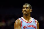 CHARLOTTE, NC - FEBRUARY 11:  Chris Paul #3 of the Los Angeles Clippers watches on against the Charlotte Bobcats during their game at Time Warner Cable Arena on February 11, 2012 in Charlotte, North Carolina. NOTE TO USER: User expressly acknowledges and agrees that, by downloading and or using this photograph, User is consenting to the terms and conditions of the Getty Images License Agreement.  (Photo by Streeter Lecka/Getty Images)