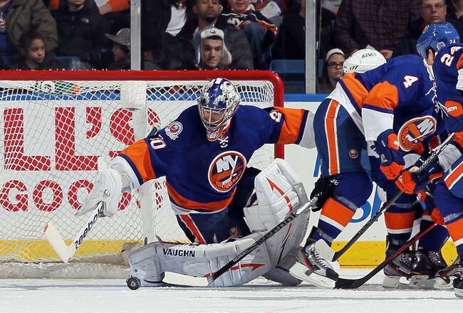 UNIONDALE, NY - FEBRUARY 11:  Evgeni Nabokov #20 of the New York Islanders makes a save against the Los Angeles Kings on February 11, 2012 at Nassau Coliseum in Uniondale, New York. The Islanders defeated the Kings 2-1 in overtime.  (Photo by Jim McIsaac/Getty Images)