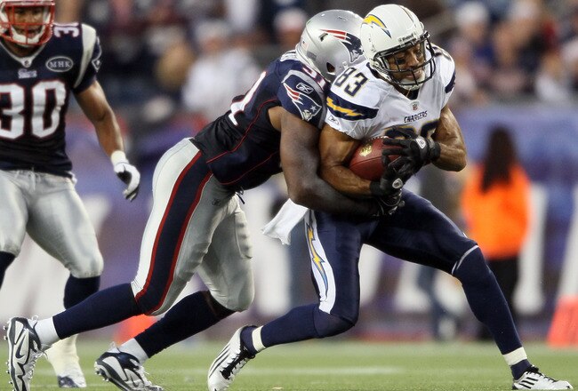 FOXBORO, MA - SEPTEMBER 18:   Vincent Jackson #83 of the San Diego Chargers is tackled by Jerod Mayo #51 of the New England Patriots on September 18, 2011 at Gillette Stadium in Foxboro, Massachusetts.  (Photo by Elsa/Getty Images)