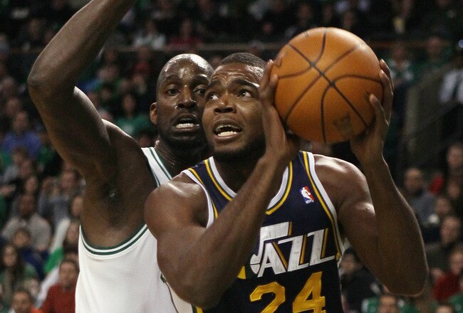 BOSTON, MA - JANUARY 21:  Paul Millsap #24 of the Utah Jazz heads for the net as Kevin Garnett #5 of the Boston Celtics defends on January 21, 2011 at the TD Garden in Boston, Massachusetts.  NOTE TO USER: User expressly acknowledges and agrees that, by downloading and/or using this Photograph, User is consenting to the terms and conditions of the Getty Images License Agreement.  (Photo by Elsa/Getty Images)