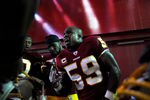 LANDOVER, MD - NOVEMBER 6: Linebacker London Fletcher #59 of the Washington Redskins pumps up other linebackers before taking on the San Francisco 49ers at FedExField on November 6, 2011 in Landover, Maryland. (Photo by Patrick Smith/Getty Images)