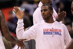 LOS ANGELES, CA - JANUARY 04:  Chris Paul #3 of the Los Angeles Clippers celebrates with teammates after the game with the Houston Rockets at Staples Center on January 4, 2012 in Los Angeles, California.  The Clippers won 117-89.  NOTE TO USER: User expressly acknowledges and agrees that, by downloading and or using this photograph, User is consenting to the terms and conditions of the Getty Images License Agreement.  (Photo by Stephen Dunn/Getty Images)