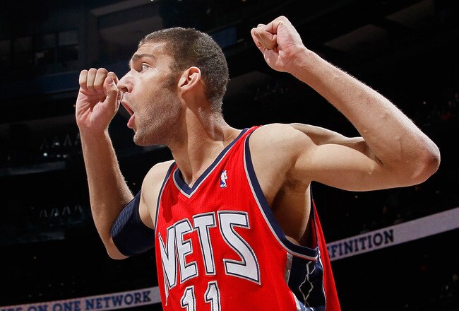 ATLANTA, GA - DECEMBER 07:   Brook Lopez #11 of the New Jersey Nets reacts after being called for a foul against the Atlanta Hawks at Philips Arena on December 7, 2010 in Atlanta, Georgia.  NOTE TO USER: User expressly acknowledges and agrees that, by downloading and/or using this Photograph, User is consenting to the terms and conditions of the Getty Images License Agreement.  (Photo by Kevin C. Cox/Getty Images)