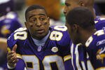 7 Oct 2001: Cris Carter #80 talks with teammates Daunte Culpepper #11 and Randy Moss #84 of the Minnesota Vikings during the game against the New Orleans Saints at the Superdome in New Orleans, Louisiana. The Saints won 28-15. DIGITAL IMAGE. Mandatory Credit: Ronald Martinez/ALLSPORT
