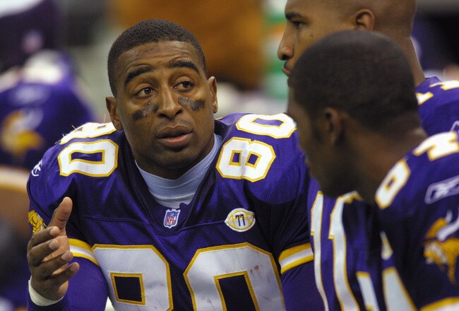 7 Oct 2001: Cris Carter #80 talks with teammates Daunte Culpepper #11 and Randy Moss #84 of the Minnesota Vikings during the game against the New Orleans Saints at the Superdome in New Orleans, Louisiana. The Saints won 28-15. DIGITAL IMAGE. Mandatory Credit: Ronald Martinez/ALLSPORT