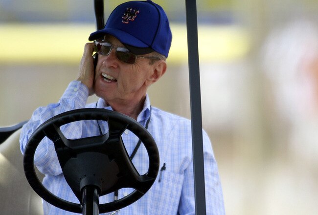 PORT ST. LUCIE, FL - FEBRUARY 17: Owner Fred Wilpon of the New York Mets talks on the phone during spring training at Tradition Field on February 17, 2011 in Port St. Lucie, Florida.  (Photo by Marc Serota/Getty Images)