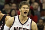 NEWARK, NJ - APRIL 03:  Brook Lopez #11 of the New Jersey Nets reacts against the Miami Heat at the Prudential Center on April 3, 2011 in Newark, New Jersey.The Heat defeated the Nets 108-94.NOTE TO USER: User expressly acknowledges and agrees that, by downloading and/or using this Photograph, user is consenting to the terms and conditions of the Getty Images License Agreement.  (Photo by Jim McIsaac/Getty Images)