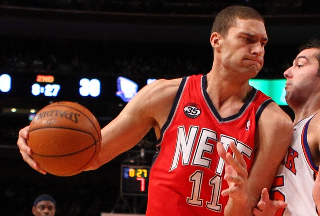 NEW YORK, NY - DECEMBER 21:  Brook Lopez #11 of the New Jersey Nets in action against the New York Knicks during their pre season game  at Madison Square Garden on December 21, 2011 in New York City.  (Photo by Al Bello/Getty Images) NOTE TO USER: User expressly acknowledges and agrees that, by downloading and or using this photograph, User is consenting to the terms and conditions of the Getty Images License Agreement.