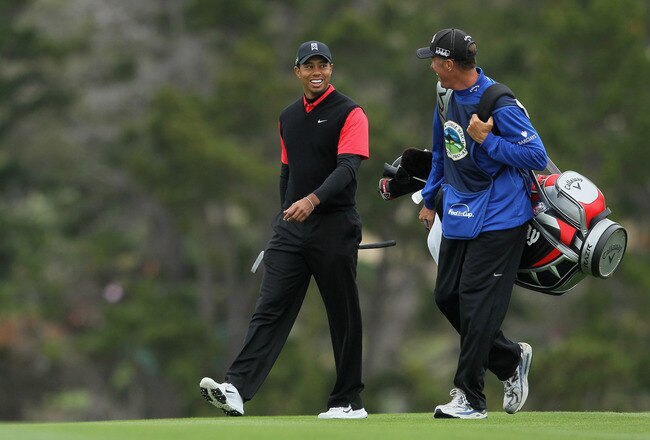 PEBBLE BEACH, CA - FEBRUARY 12: (L-R) Tiger Woods and caddie Jim 'Bones' Mackay walk up the sixth fairway during the final round of the AT&T Pebble Beach National Pro-Am at Pebble Beach Golf Links on February 12, 2012 in Pebble Beach, California.  (Photo by Jeff Gross/Getty Images)