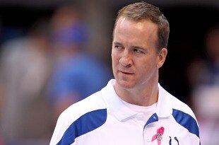 INDIANAPOLIS, IN - OCTOBER 09:  Peyton Manning of the Indianapolis Colts watches his team warm up before the NFL game against the Kansas City Chiefs at Lucas Oil Stadium on October 9, 2011 in Indianapolis, Indiana.  (Photo by Andy Lyons/Getty Images)