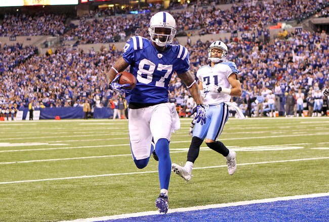 INDIANAPOLIS - JANUARY 02:  Reggie Wayne #87 of the Indianapolis Colts runs for a touchdown during NFL game against the Tennessee Titans at Lucas Oil Stadium on January 2, 2011 in Indianapolis, Indiana.  (Photo by Andy Lyons/Getty Images)