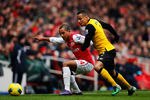 LONDON, ENGLAND - FEBRUARY 04:  Theo Walcott of Arsenal and Martin Olsson battle for the ball during the Barclays Premier League match between Arsenal and Blackburn Rovers at Emirates Stadium on February 4, 2012 in London, England.  (Photo by Paul Gilham/Getty Images)