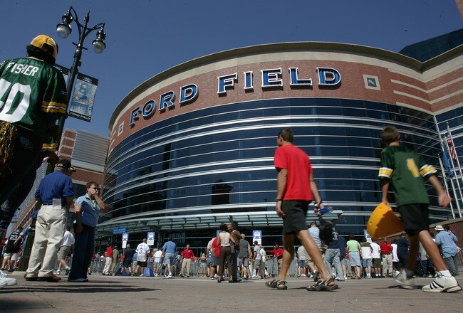 DETROIT - SEPTEMBER 11: Fans mingle outside the entrance of Ford Field before the kickoff of the Season Opening game between the Green Bay Packers and the Detroit Lions on September 11, 2005 at Ford Field in Detroit, Michigan.  (Photo by Jonathan Ferrey/Getty Images)