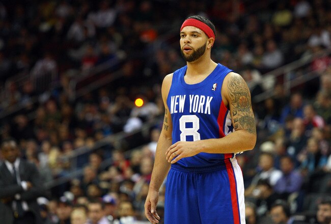 NEWARK, NJ - FEBRUARY 11:  Deron Williams #8 of the New Jersey Nets looks on in the first half against the San Antonio Spurs at Prudential Center on February 11, 2012 in Newark, New Jersey.  NOTE TO USER: User expressly acknowledges and agrees that, by downloading and or using this photograph, User is consenting to the terms and conditions of the Getty Images License Agreement.  (Photo by Chris Chambers/Getty Images)