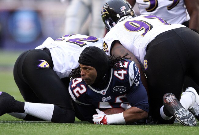 FOXBORO, MA - JANUARY 22:  BenJarvus Green-Ellis #42 of the New England Patriots looks on after losing his helmet while playing against Arthur Jones #97 and  Jimmy Smith #22 of the Baltimore Ravens during their AFC Championship Game at Gillette Stadium on January 22, 2012 in Foxboro, Massachusetts.  (Photo by Elsa/Getty Images)