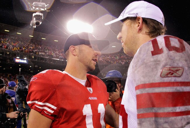 SAN FRANCISCO, CA - JANUARY 22:  (L-R) Alex Smith #11 of the San Francisco 49ers congratulates Eli Manning #10 of the New York Giants after the GIants won 20-17 in overtime during the NFC Championship Game at Candlestick Park on January 22, 2012 in San Francisco, California.  (Photo by Doug Pensinger/Getty Images)