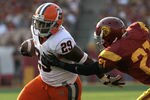 LOS ANGELES - SEPTEMBER 17:  Running back Antwon Bailey #29 of the Syracuse Orangemen carries the ball against cornerback Nickell Robey #21 of the USC Trojans at the Los Angeles Memorial Coliseum on September 17, 2011 in Los Angeles, California.  (Photo by Stephen Dunn/Getty Images)