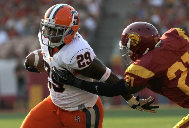 LOS ANGELES - SEPTEMBER 17:  Running back Antwon Bailey #29 of the Syracuse Orangemen carries the ball against cornerback Nickell Robey #21 of the USC Trojans at the Los Angeles Memorial Coliseum on September 17, 2011 in Los Angeles, California.  (Photo by Stephen Dunn/Getty Images)