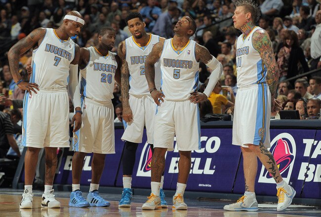DENVER, CO - APRIL 25:  Al Harrington #7, Raymond Felton #20, Wilson Chandler, J.R. Smith #5 and Chris Andersen #11 of the Denver Nuggets look on as they face the Oklahoma City Thunder in Game Four of the Western Conference Quarterfinals in the 2011 NBA Playoffs on April 24, 2011 at the Pepsi Center in Denver, Colorado. NOTE TO USER: User expressly acknowledges and agrees that, by downloading and or using this photograph, User is consenting to the terms and conditions of the Getty Images License Agreement.  (Photo by Doug Pensinger/Getty Images)
