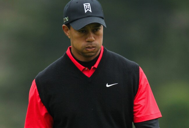 PEBBLE BEACH, CA - FEBRUARY 12: Tiger Woods reacts to a missed birdie putt on the 13th hole during the final round of the AT&T Pebble Beach National Pro-Am at Pebble Beach Golf Links on February 12, 2012 in Pebble Beach, California.  (Photo by Jeff Gross/Getty Images)