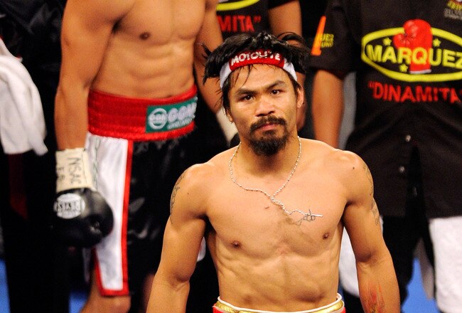 LAS VEGAS, NV - NOVEMBER 12:  Boxers Juan Manuel Marquez (L) and Manny Pacquiao appear in the ring before their WBO world welterweight title fight at the MGM Grand Garden Arena November 12, 2011 in Las Vegas, Nevada. Pacquiao retained his title with a majority decision victory.  (Photo by Ethan Miller/Getty Images)