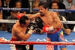 LAS VEGAS, NV - NOVEMBER 12:  (R-L) Manny Pacquiao throws a right to the head of Juan Manuel Marquez during the WBO world welterweight title fight at the MGM Grand Garden Arena on November 12, 2011 in Las Vegas, Nevada.  (Photo by Ethan Miller/Getty Images)