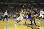 ORLANDO, FL - JUNE 11:  Rafer Alston #1 of the Orlando Magic moves the ball against Derek Fisher #2 and Didier Ilunga-Mbenga #28 of the Los Angeles Lakers in Game Four of the 2009 NBA Finals on June 11, 2009 at Amway Arena in Orlando, Florida. The Lakers won in overtime 99-91. NOTE TO USER:  User expressly acknowledges and agrees that, by downloading and or using this photograph, User is consenting to the terms and conditions of the Getty Images License Agreement. (Photo by Chris Graythen/Getty Images)