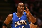 EAST RUTHERFORD, NJ - NOVEMBER 16:  Dwight Howard #12 of the Orlando Magic celebrates a basket against the New Jersey Nets during their game at the Izod Center on November 16, 2007 in East Rutherford, New Jersey.The Magic defeated the Nets 95-70. NOTE TO USER: User expressly acknowledges and agrees that, by downloading and/or using this Photograph, User is consenting to the terms and conditions of the Getty Images License Agreement.  (Photo by Jim McIsaac/Getty Images)