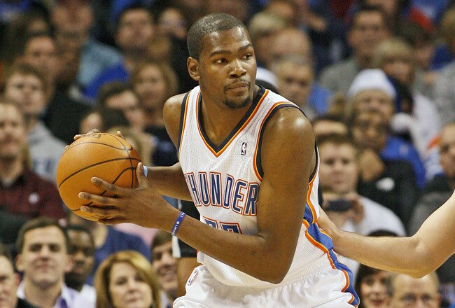 OKLAHOMA CITY, OK - DECEMBER 25:  Kevin Durant #35 of the Oklahoma City Thunder looks to drive on Hedo Turkoglu #15 of the Orlando Magic during the NBA season opening game December 25, 2011 at the Chesapeake Energy Arena in Oklahoma City, Oklahoma.  Oklahoma City led Orlando at the half. NOTE TO USER: User expressly acknowledges and agrees that, by downloading and or using this Photograph, user is consenting to the terms and conditions of the Getty Images License Agreement.  (Photo by Brett Deering/Getty Images)