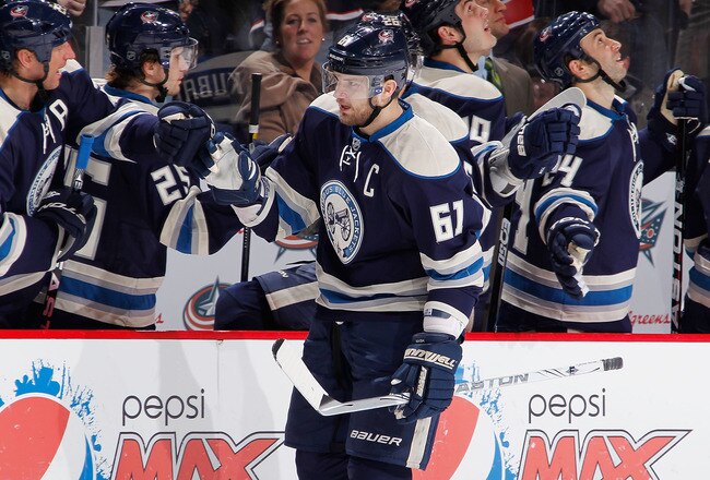 COLUMBUS, OH - JANUARY 14:  Rick Nash #61 of the Columbus Blue Jackets celebrates a third period goal with teammates while playing the San Jose Sharks at Nationwide Arena on January 14, 2012 in Columbus, Ohio. The San Jose Sharks won the game 2-1. (Photo by Gregory Shamus/Getty Images)