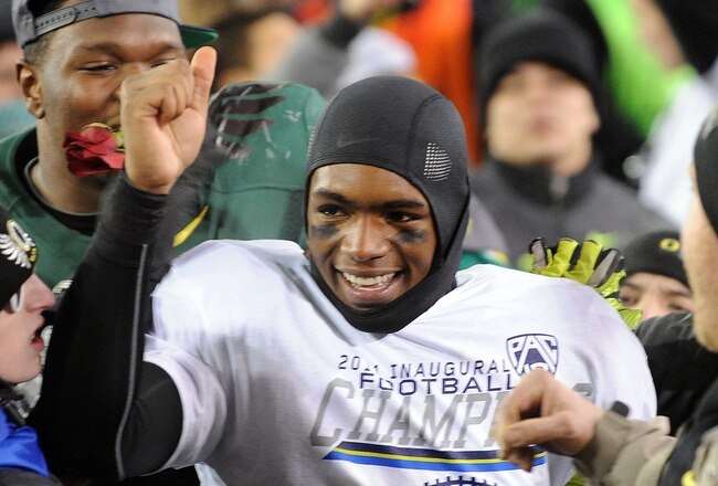 EUGENE, OR - DECEMBER 02 : Quarterback Darron Thomas #5 of the Oregon Ducks celebrates winning the Pac-12 Championship against the UCLA Bruins at Autzen Stadium on December 2, 2011 in Eugene, Oregon. The Ducks won the game 49-31 to earn a berth in the Rose Bowl. (Photo by Steve Dykes/Getty Images)