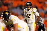 MIAMI GARDENS, FL - JANUARY 04:  Geno Smith #12 of the West Virginia Mountaineers calls signals out of the shotgun formation against the Clemson Tigers during the Discover Orange Bowl at Sun Life Stadium on January 4, 2012 in Miami Gardens, Florida.  (Photo by Mike Ehrmann/Getty Images)