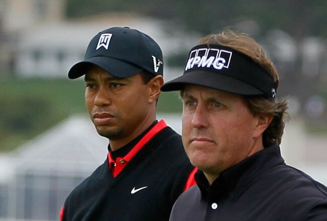 PEBBLE BEACH, CA - FEBRUARY 12: (L-R) Tiger Woods and Phil Mickelson wait on the seventh hole tee during the final round of the AT&T Pebble Beach National Pro-Am at Pebble Beach Golf Links on February 12, 2012 in Pebble Beach, California.  (Photo by Jeff Gross/Getty Images)