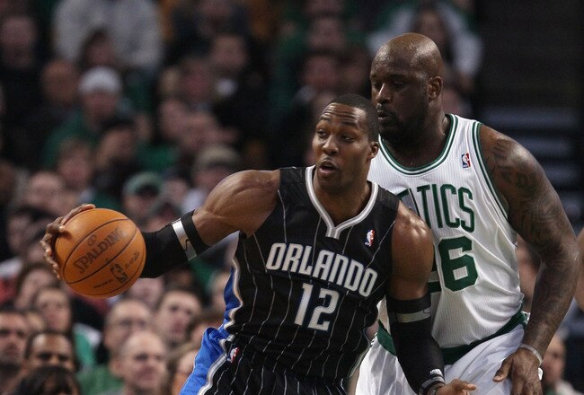 BOSTON, MA - JANUARY 17:  Dwight Howard #12 of the Orlando Magic tries to get around Shaquille O'Neal #36 of the Boston Celtics on January 17, 2011 at the TD Garden in Boston, Massachusetts.  NOTE TO USER: User expressly acknowledges and agrees that, by downloading and/or using this Photograph, User is consenting to the terms and conditions of the Getty Images License Agreement.  (Photo by Elsa/Getty Images)