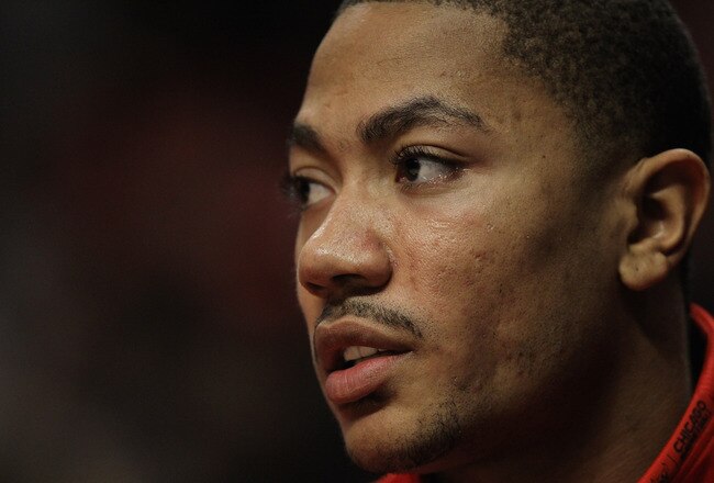 CHICAGO, IL - FEBRUARY 14: Derrick Rose #1 of the Chicago Bulls, held out of the game with a sore back, watches his teammates take on the Sacramento Kings at the United Center on February 14, 2012 in Chicago, Illinois. The Bulls defeated the Kings 121-115. NOTE TO USER: User expressly acknowledges and agrees that, by downloading and or using this photograph, User is consenting to the terms and conditions of the Getty Images License Agreement. (Photo by Jonathan Daniel/Getty Images)