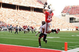COLUMBUS, OH - SEPTEMBER 24:  Devin Smith #15 of the Ohio State Buckeyes pulls in a 17-yard touchdown catch over Greg Henderson #20 of the Colorado Buffaloes in the third quarter at Ohio Stadium on September 24, 2011 in Columbus, Ohio.  (Photo by Jamie Sabau/Getty Images)