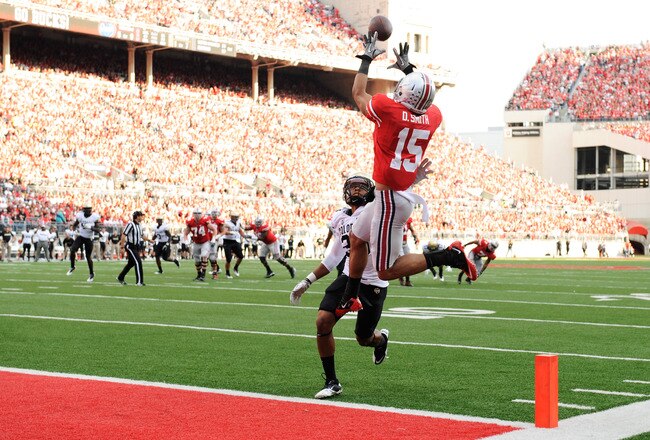 COLUMBUS, OH - SEPTEMBER 24:  Devin Smith #15 of the Ohio State Buckeyes pulls in a 17-yard touchdown catch over Greg Henderson #20 of the Colorado Buffaloes in the third quarter at Ohio Stadium on September 24, 2011 in Columbus, Ohio.  (Photo by Jamie Sabau/Getty Images)