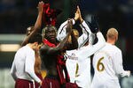 MILAN, ITALY - MARCH 04:  PBakari Sagna of Arsenal celebrates winning the UEFA Champions League 1st knockout round 2nd leg match between AC Milan and Arsenal at the San Siro stadium on March 4, 2008 in Milan, Italy.  (Photo by Mike Hewitt/Getty Images)