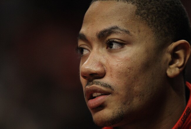 CHICAGO, IL - FEBRUARY 14: Derrick Rose #1 of the Chicago Bulls, held out of the game with a sore back, watches his teammates take on the Sacramento Kings at the United Center on February 14, 2012 in Chicago, Illinois. The Bulls defeated the Kings 121-115. NOTE TO USER: User expressly acknowledges and agrees that, by downloading and or using this photograph, User is consenting to the terms and conditions of the Getty Images License Agreement. (Photo by Jonathan Daniel/Getty Images)