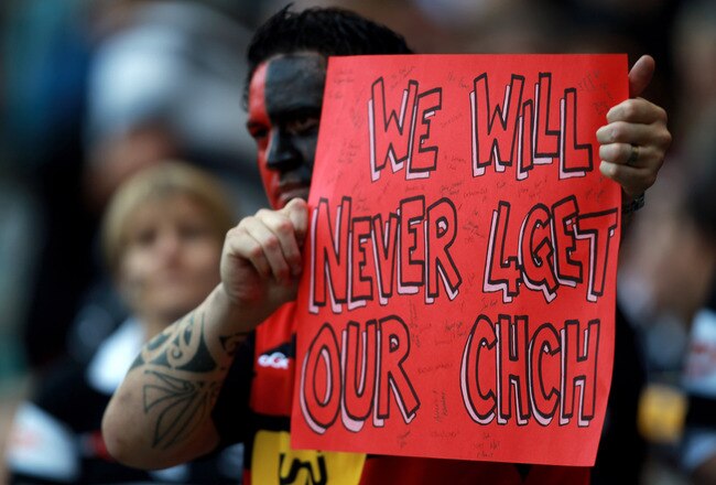 LONDON, ENGLAND - MARCH 27:  A fan displays a banner in memory of the Christchurch earthquake  ahead of the round six Super Rugby match between the Crusaders and the Sharks at Twickenham Stadium on March 27, 2011 in London, United Kingdom.  (Photo by Warren Little/Getty Images)