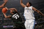DENVER - NOVEMBER 03:  Trenton Hassell #23 of the Minnesota Timberwolves gets off a shot over J.R. Smith #1 of the Denver Nuggets as the Timberwolves defeated the Nuggets 112-109 on November 3, 2006 at the Pepsi Center in Denver, Colorado. NOTE TO USER: User expressly acknowledges and agrees that, by downloading and or using this Photograph, user is consenting to the terms and conditions of the Getty Images License Agreement.  (Photo by Doug Pensinger/Getty Images)