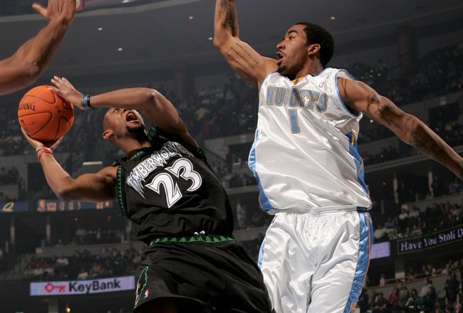DENVER - NOVEMBER 03:  Trenton Hassell #23 of the Minnesota Timberwolves gets off a shot over J.R. Smith #1 of the Denver Nuggets as the Timberwolves defeated the Nuggets 112-109 on November 3, 2006 at the Pepsi Center in Denver, Colorado. NOTE TO USER: User expressly acknowledges and agrees that, by downloading and or using this Photograph, user is consenting to the terms and conditions of the Getty Images License Agreement.  (Photo by Doug Pensinger/Getty Images)