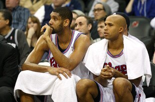 NEWARK, NJ - FEBRUARY 11:  (L-R) Tim Duncan #21 and Richard Jefferson #24 of the San Antonio Spurs look on from the bench against the New Jersey Nets at Prudential Center on February 11, 2012 in Newark, New Jersey.  NOTE TO USER: User expressly acknowledges and agrees that, by downloading and or using this photograph, User is consenting to the terms and conditions of the Getty Images License Agreement.  (Photo by Chris Chambers/Getty Images)