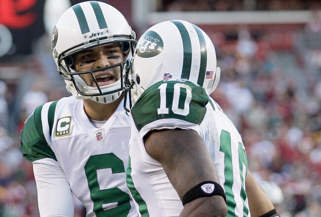 LANDOVER, MD - DECEMBER 04:  Mark Sanchez #6 of the New York Jets celebrates after throwing a touchdown pass to Santonio Holmes #10 during the second half against the Washington Redskins at FedExField on December 4, 2011 in Landover, Maryland.  (Photo by Rob Carr/Getty Images)