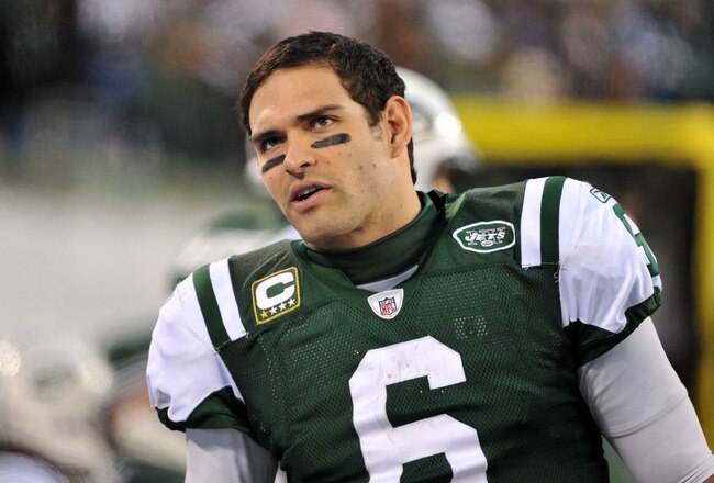 EAST RUTHERFORD, NJ - DECEMBER 24: Mark Sanchez #6 of the New York Jets talks on the bench during the second half against the New York Giants on December 24, 2011 at MetLife Stadium in East Rutherford, New Jersey. (Photo by Christopher Pasatieri/Getty Images)